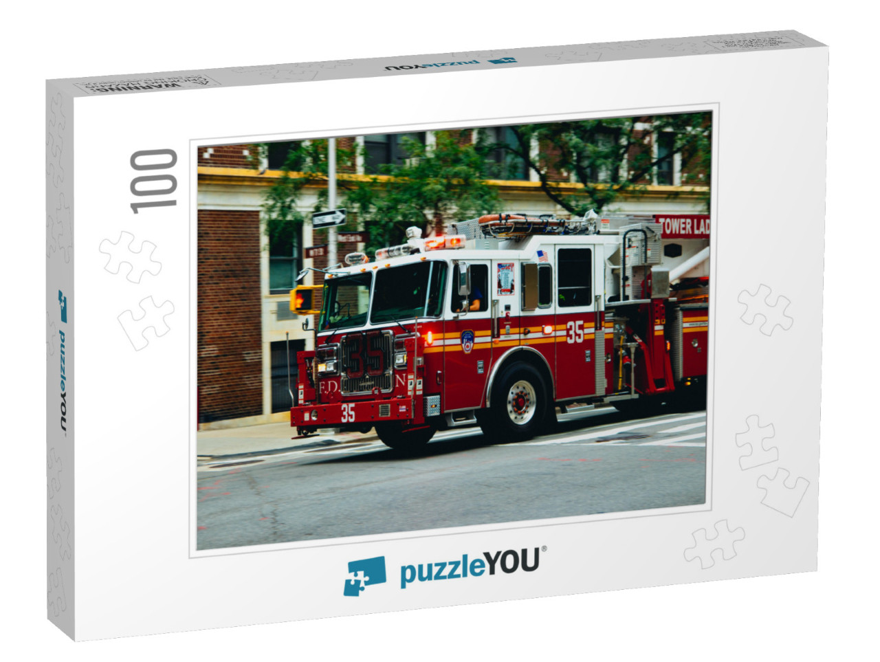 Nyc Firetruck Driving on a Road... Jigsaw Puzzle with 100 pieces