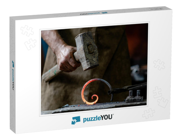 Closeup Blacksmith is Processing a Hot Metal Object of a... Jigsaw Puzzle