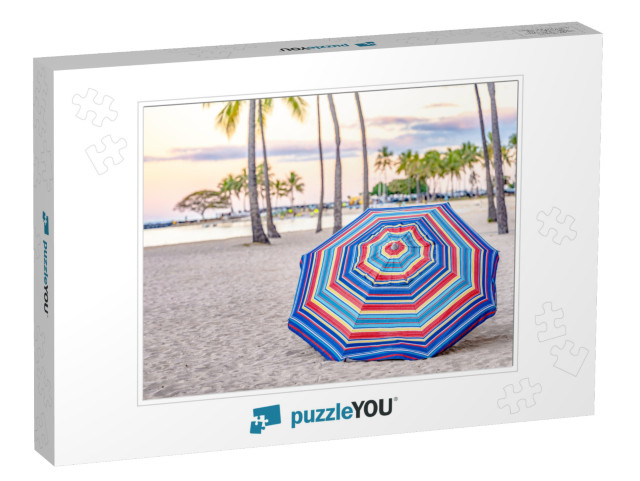 A Beautiful Striped Umbrella on the Beach At Sunset, in W... Jigsaw Puzzle