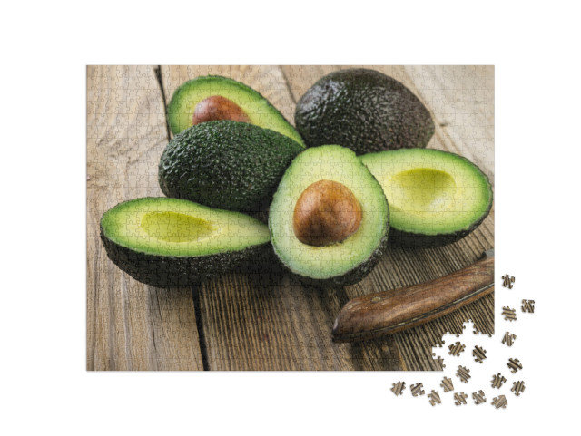 Fresh Sliced Avocado on Wooden Table. Vegetarian Food Con... Jigsaw Puzzle with 1000 pieces