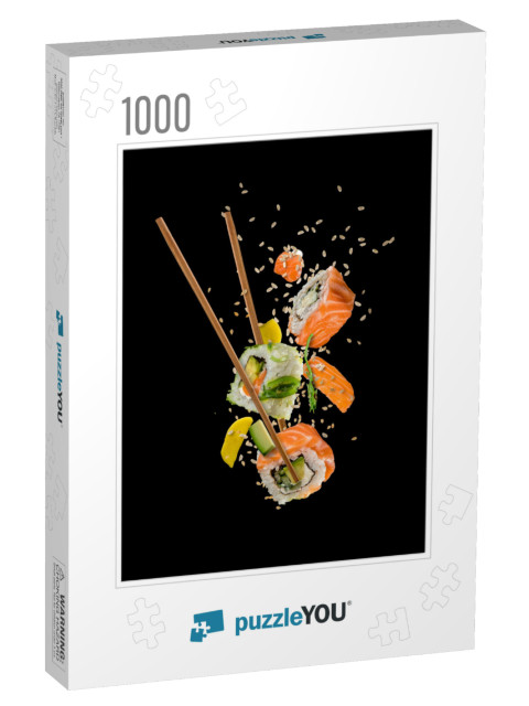 Sushi Pieces Placed Between Chopsticks, Separated on Blac... Jigsaw Puzzle with 1000 pieces