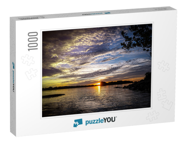 A Beautiful View of the Sun on the Horizon Next to the Mi... Jigsaw Puzzle with 1000 pieces