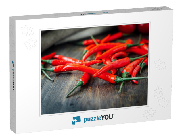 Red Hot Chili Peppers Over Rustic Wooden Table... Jigsaw Puzzle