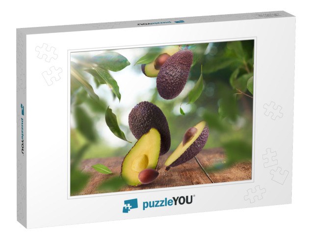 Fresh Raw Avocados Falling in the Air on Wooden Table Ove... Jigsaw Puzzle