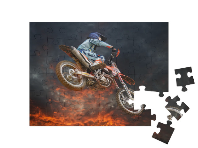 Jumping Motocross Rider with Firestorm in the Background... Jigsaw Puzzle with 48 pieces